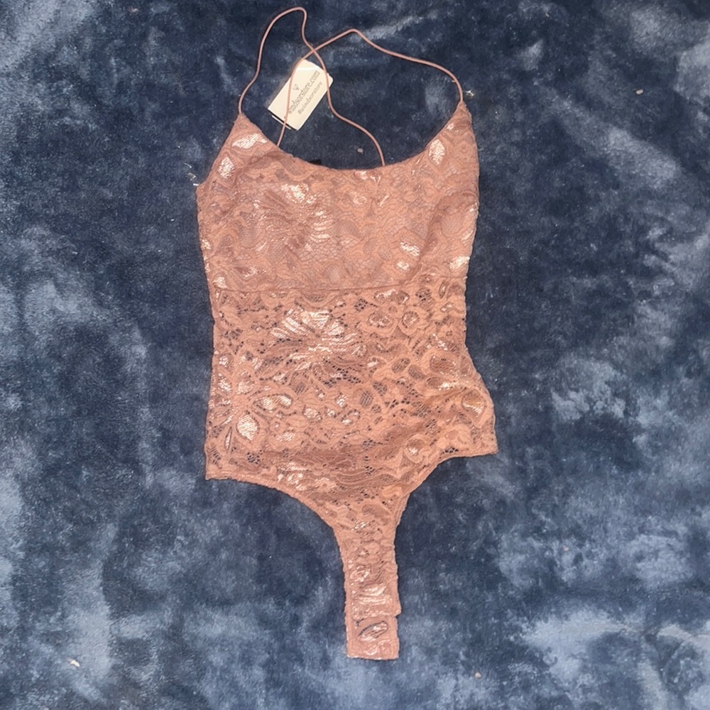 Laced pastel pink body suit